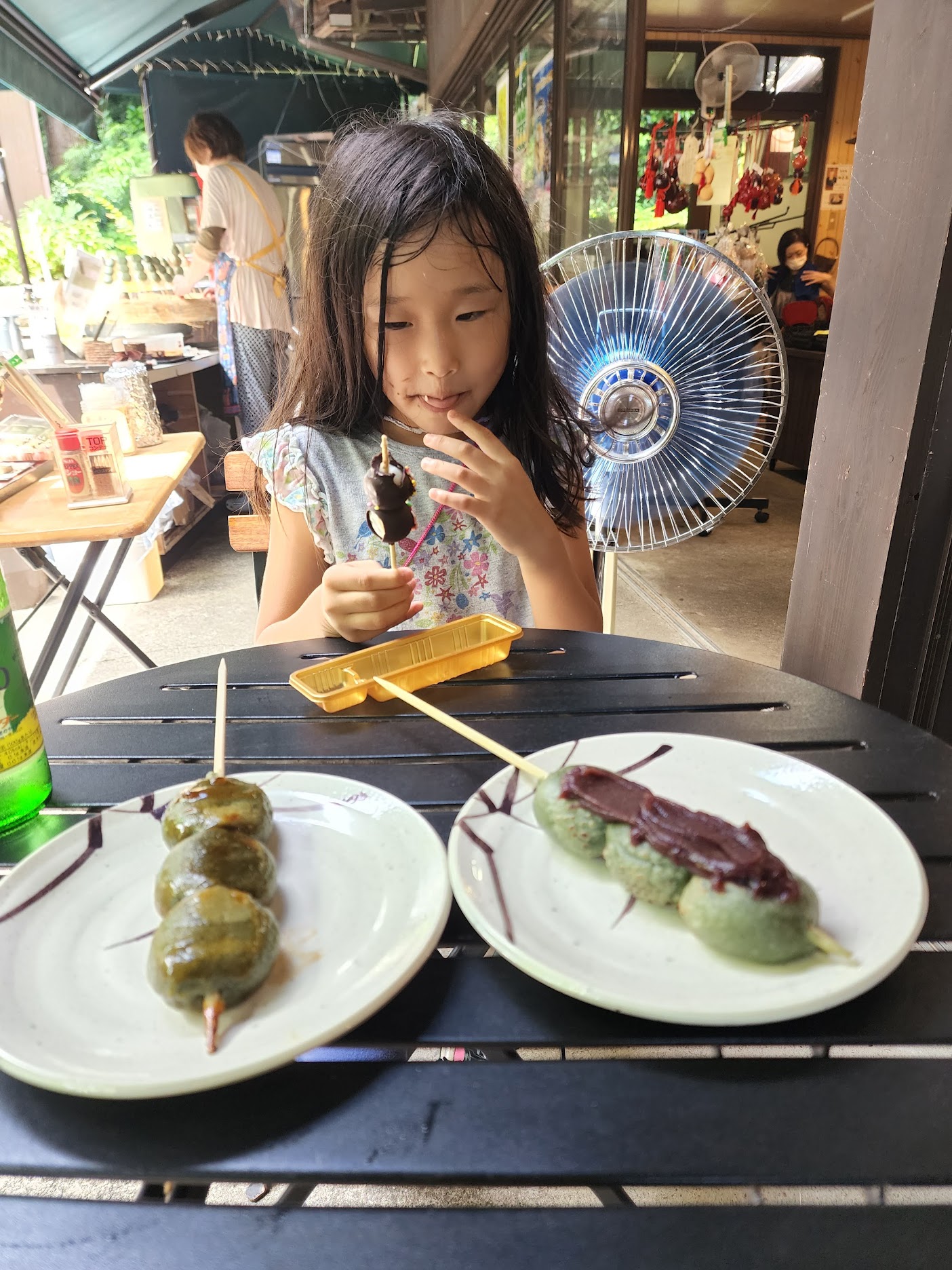 dango with red beans, chocolate and soy sauce. guess who is eating the chocolate dango
